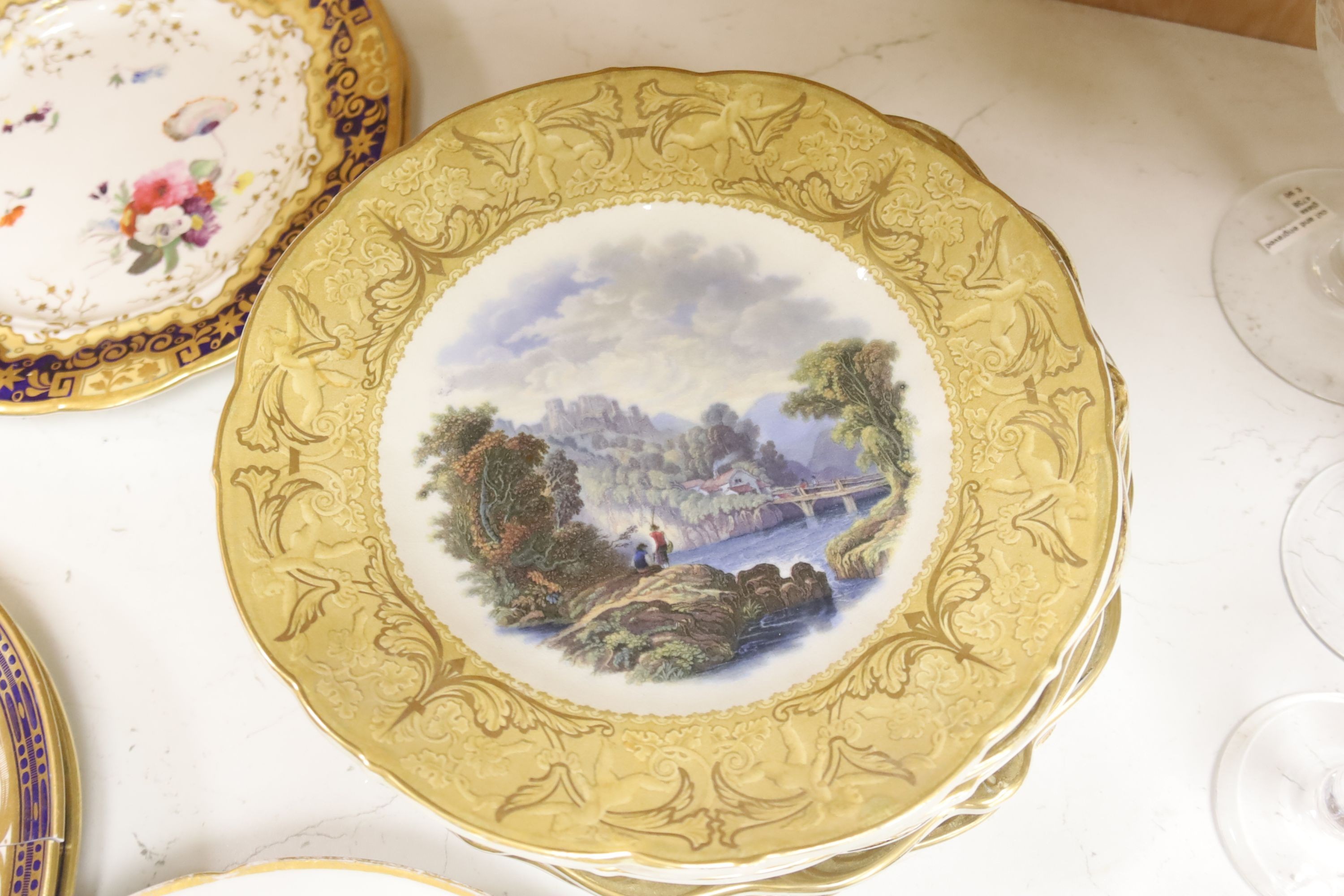 A collection of eight F & R Pratt landscape plates and six 19th-century porcelain plates